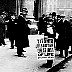 A Newsboy with an edition of his paper about the sinking